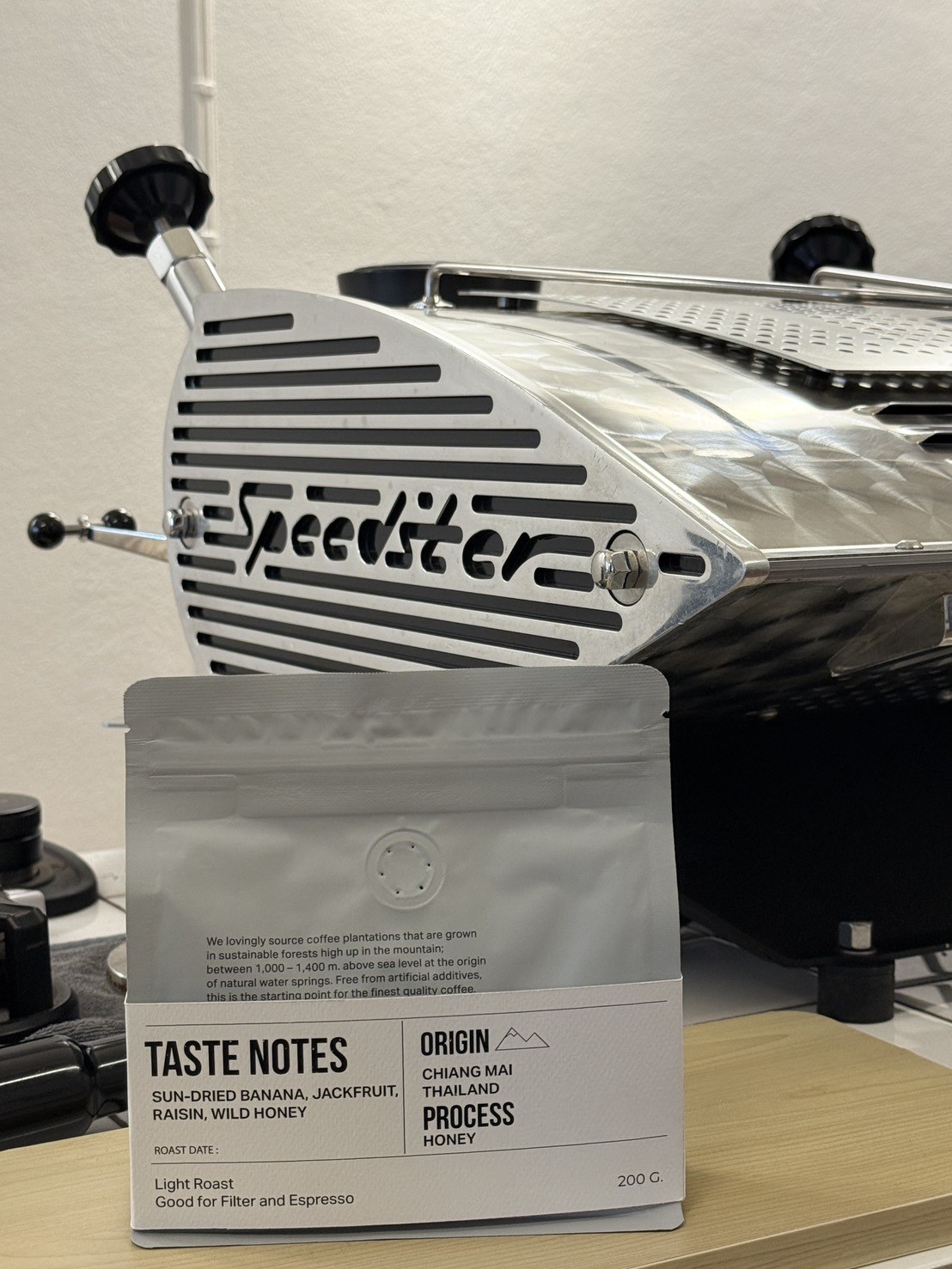 Reverse of Izzy’s coffee pack showing taste notes and origin information